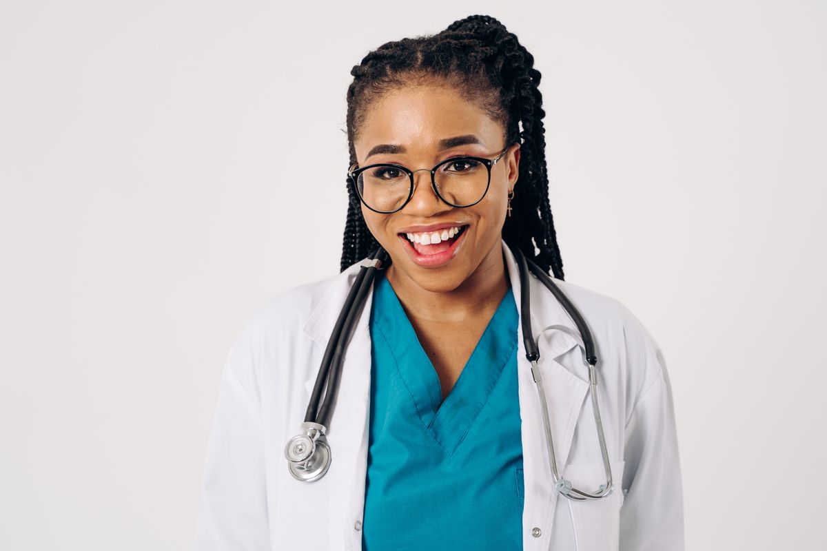 Portrait of a smiling female doctor in a lab coat and stethoscope
