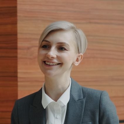 Two professionals having a conversation during a business meeting indoors