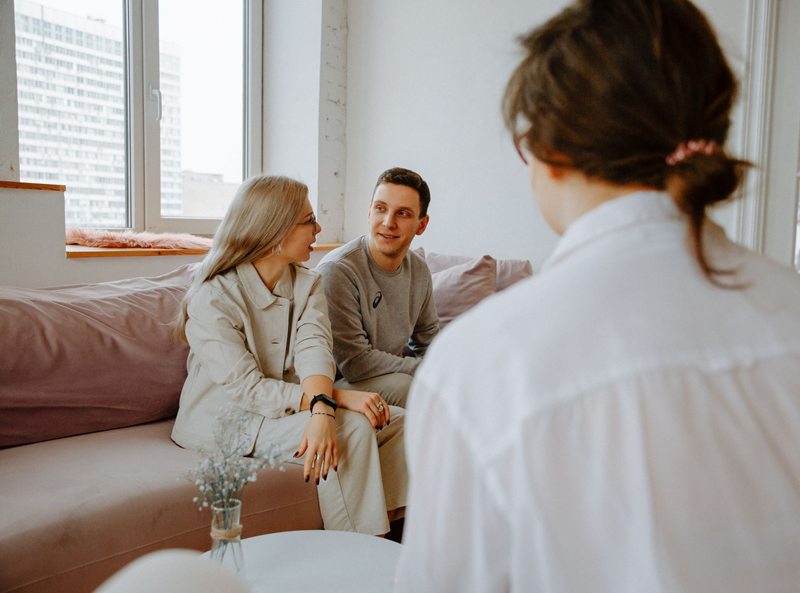 Couple engaged in counseling session with therapist