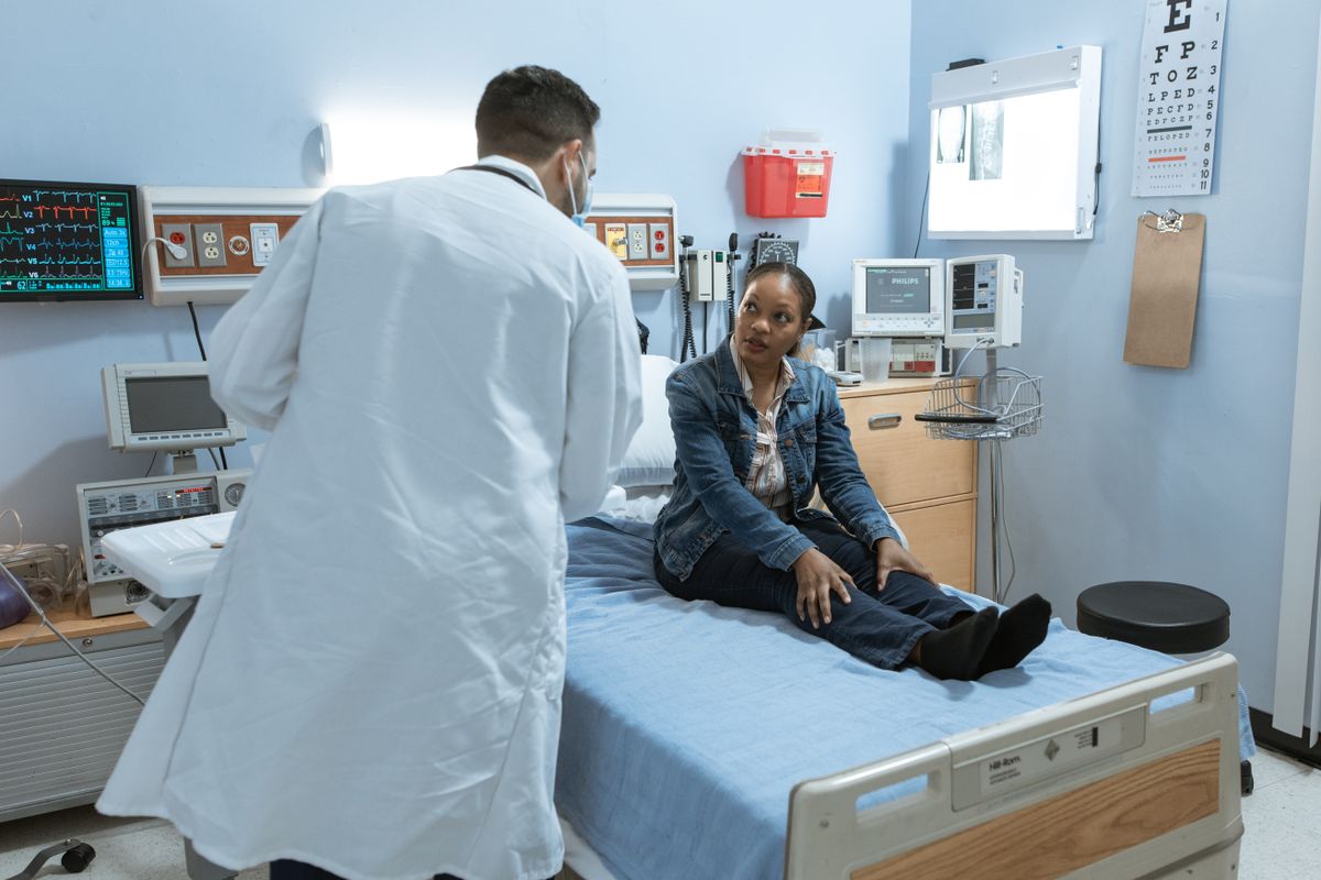 A doctor consults with a patient