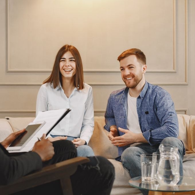 A couple meeting with an advisor during a consultation